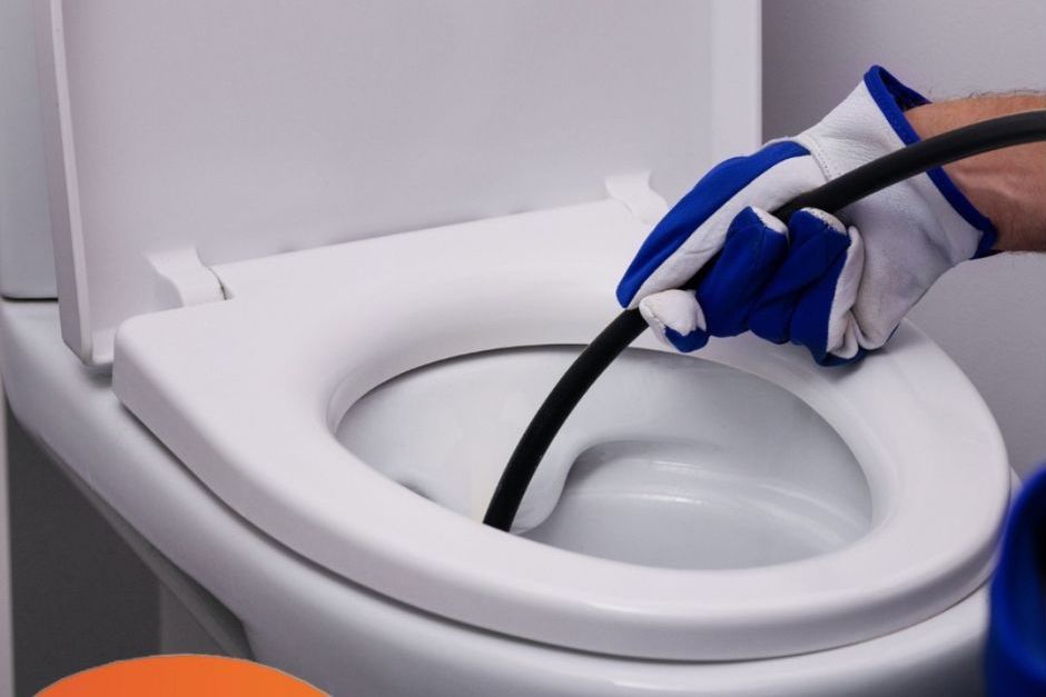 Unblocking a Blocked Toilet using a cable